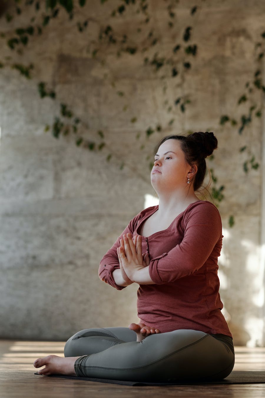 White young female doing yoga.