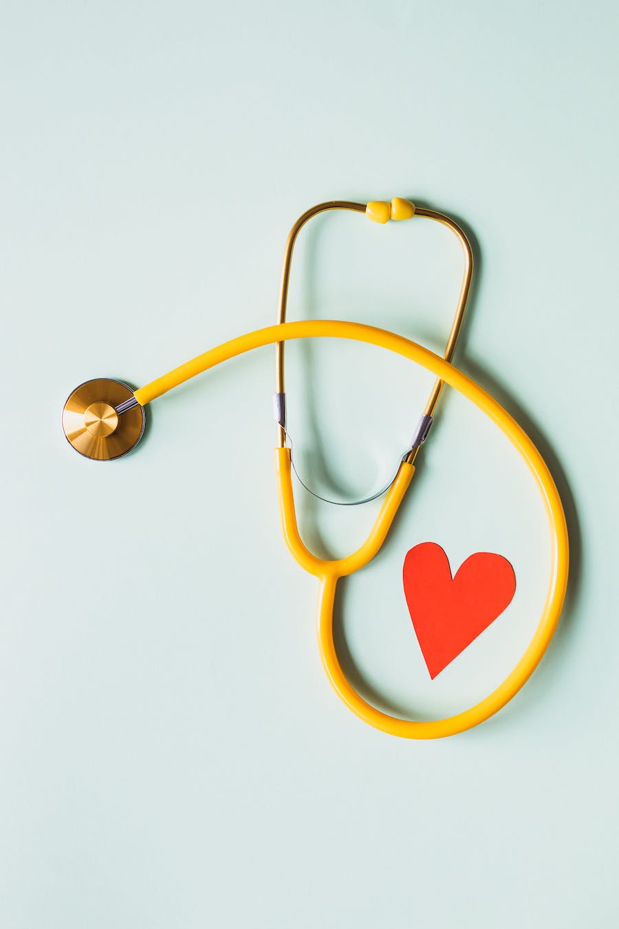 Yellow stethoscope with a heart